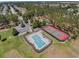 Aerial view of the community pool and tennis courts with ample parking and playground at 335 Prestwick Dr, Davenport, FL 33897