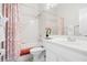Clean bathroom featuring a shower-tub combo with shower curtain and white fixtures at 335 Prestwick Dr, Davenport, FL 33897