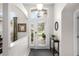 Bright foyer with double doors, transom window, and view to the outside at 335 Prestwick Dr, Davenport, FL 33897