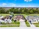 Charming home with a well-maintained lawn, mature landscaping, and a spacious driveway at 335 Prestwick Dr, Davenport, FL 33897