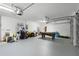 Spacious garage featuring a pool table, storage, and garage door at 335 Prestwick Dr, Davenport, FL 33897