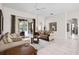 Inviting living room with couches, tile floors, and sliding doors to outdoor pool at 335 Prestwick Dr, Davenport, FL 33897