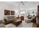 Spacious living room with tile floors that opens into the kitchen at 335 Prestwick Dr, Davenport, FL 33897