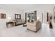 Bright and airy living room with tile floors, comfortable seating, and sliding doors to the pool at 335 Prestwick Dr, Davenport, FL 33897