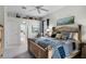 Comfortable main bedroom boasts a neutral palette and adjacent entry to the main bathroom at 335 Prestwick Dr, Davenport, FL 33897