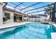 A beautiful screened pool with plenty of room for seating and relaxing at 335 Prestwick Dr, Davenport, FL 33897