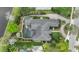 Overhead view of luxury home featuring a private pool, manicured gardens, and a sprawling backyard at 3358 Fernlake Pl, Longwood, FL 32779