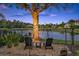 Picturesque backyard featuring a serene lake view, comfortable seating and access to the water at 3358 Fernlake Pl, Longwood, FL 32779