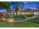 Expansive backyard featuring lush landscaping, a brick walkway, and a screened-in lanai at 3358 Fernlake Pl, Longwood, FL 32779