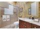 Bathroom with elegant vanity with granite counters, and a walk-in shower with glass door at 3358 Fernlake Pl, Longwood, FL 32779