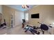 Bright exercise room with workout equipment, mirrored wall, and natural light from the window at 3358 Fernlake Pl, Longwood, FL 32779
