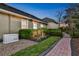 Exterior shot featuring well-maintained landscaping, a brick pathway, and a Generac generator at 3358 Fernlake Pl, Longwood, FL 32779