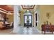 Grand foyer with decorative ceilings, elegant chandelier, and stylish tile flooring at 3358 Fernlake Pl, Longwood, FL 32779