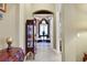 Elegant foyer showcases tile flooring, display case and arched entryway into a sitting area at 3358 Fernlake Pl, Longwood, FL 32779