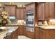 Spacious kitchen with stainless steel appliances and granite countertops at 3358 Fernlake Pl, Longwood, FL 32779