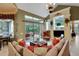 Open living room with comfortable furniture, a view of the lanai, and a view of the eat-in kitchen at 3358 Fernlake Pl, Longwood, FL 32779