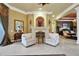 Elegant sitting area with a fireplace, beautiful decor, and access to other areas of the home at 3358 Fernlake Pl, Longwood, FL 32779