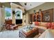 Living room boasts fireplace, built-in shelving, and comfortable seating at 3358 Fernlake Pl, Longwood, FL 32779