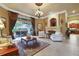 Inviting living room featuring a fireplace, tile floors, and outdoor access for seamless indoor-outdoor living at 3358 Fernlake Pl, Longwood, FL 32779