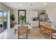 Bright dining area with a large window, dining table and convenient access to the kitchen at 33601 Seattle Slew Dr, Sorrento, FL 32776