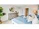 The main bedroom with a queen bed, dresser, and decor, creates a calming and inviting retreat at 33601 Seattle Slew Dr, Sorrento, FL 32776
