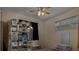 A bedroom featuring a window, ceiling fan, and items stored for moving at 3407 Pershing Ave, Orlando, FL 32812