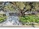 Charming single-story home with lush landscaping and mature tree in the front yard at 3407 Pershing Ave, Orlando, FL 32812