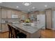Bright kitchen features custom cabinets, granite countertops, and stainless steel appliances at 3407 Pershing Ave, Orlando, FL 32812