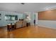 Living room features hardwood floors and a bright and airy feel with natural light at 3407 Pershing Ave, Orlando, FL 32812