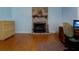 Office area with brick fireplace, built-ins, and abundant natural light at 3407 Pershing Ave, Orlando, FL 32812