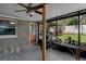 A covered outdoor patio featuring a ceiling fan and views of the backyard at 3407 Pershing Ave, Orlando, FL 32812
