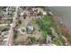 Sprawling waterfront property with marked boundaries, mature trees, offering scenic views and development potential at 3540 Walker Rd, Apopka, FL 32703