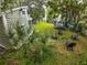 Lush backyard with well-manicured lawn, mature trees, and outdoor seating, offering a serene and private outdoor space at 5646 Spring Run Ave, Orlando, FL 32819