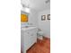 Bright bathroom with a modern vanity, clean lines, and neutral tones complemented by terra cotta flooring at 5646 Spring Run Ave, Orlando, FL 32819