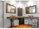 Unique bathroom featuring dual vanities with stone sinks, a modern mirror, and stylish decor at 5646 Spring Run Ave, Orlando, FL 32819