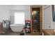 Spa-like bathroom featuring a freestanding tub and a glass-enclosed shower at 5646 Spring Run Ave, Orlando, FL 32819