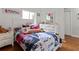Bright bedroom with hardwood floors, large window and closet storage at 5646 Spring Run Ave, Orlando, FL 32819