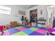 Playroom with colorful flooring, closet storage and bright natural light at 5646 Spring Run Ave, Orlando, FL 32819