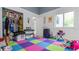 Playroom with colorful flooring, closet storage and bright natural light at 5646 Spring Run Ave, Orlando, FL 32819