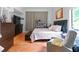 Cozy bedroom featuring brick-tile floors, a plush bed, and ample storage at 5646 Spring Run Ave, Orlando, FL 32819