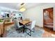 The dining room features a modern table set, bright light fixture and unique wall decor at 5646 Spring Run Ave, Orlando, FL 32819