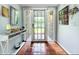 Warm entryway with terra cotta flooring, decorative accents, and a glass door leading to the outside at 5646 Spring Run Ave, Orlando, FL 32819