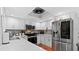 Modern kitchen featuring stainless steel appliances, subway tile backsplash, and white cabinets at 5646 Spring Run Ave, Orlando, FL 32819