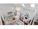 Spacious living room with high ceilings, modern chandeliers, and a cozy fireplace perfect for entertaining at 5646 Spring Run Ave, Orlando, FL 32819
