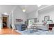 Spacious living room with high ceilings, a modern chandelier, and stylish furnishings at 5646 Spring Run Ave, Orlando, FL 32819