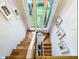 Staircase featuring unique terra cotta tile, a large window, and stylish decor enhancing the space at 5646 Spring Run Ave, Orlando, FL 32819