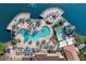 Aerial view showcases the resort's impressive pool complex, complete with a waterslide, jacuzzi, and multiple lounge areas at 5766 Lesabre Dr, Kissimmee, FL 34746