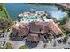 Aerial view captures the resort's stunning pool area, highlighting the waterslide, spacious deck, and lakeside setting at 5766 Lesabre Dr, Kissimmee, FL 34746