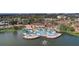 Panoramic aerial view of the resort, featuring its impressive pool complex with waterslide and stunning waterfront location at 5766 Lesabre Dr, Kissimmee, FL 34746