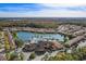 Beautiful community aerial featuring clubhouse, pool, lake, and cozy condominium homes at 5766 Lesabre Dr, Kissimmee, FL 34746